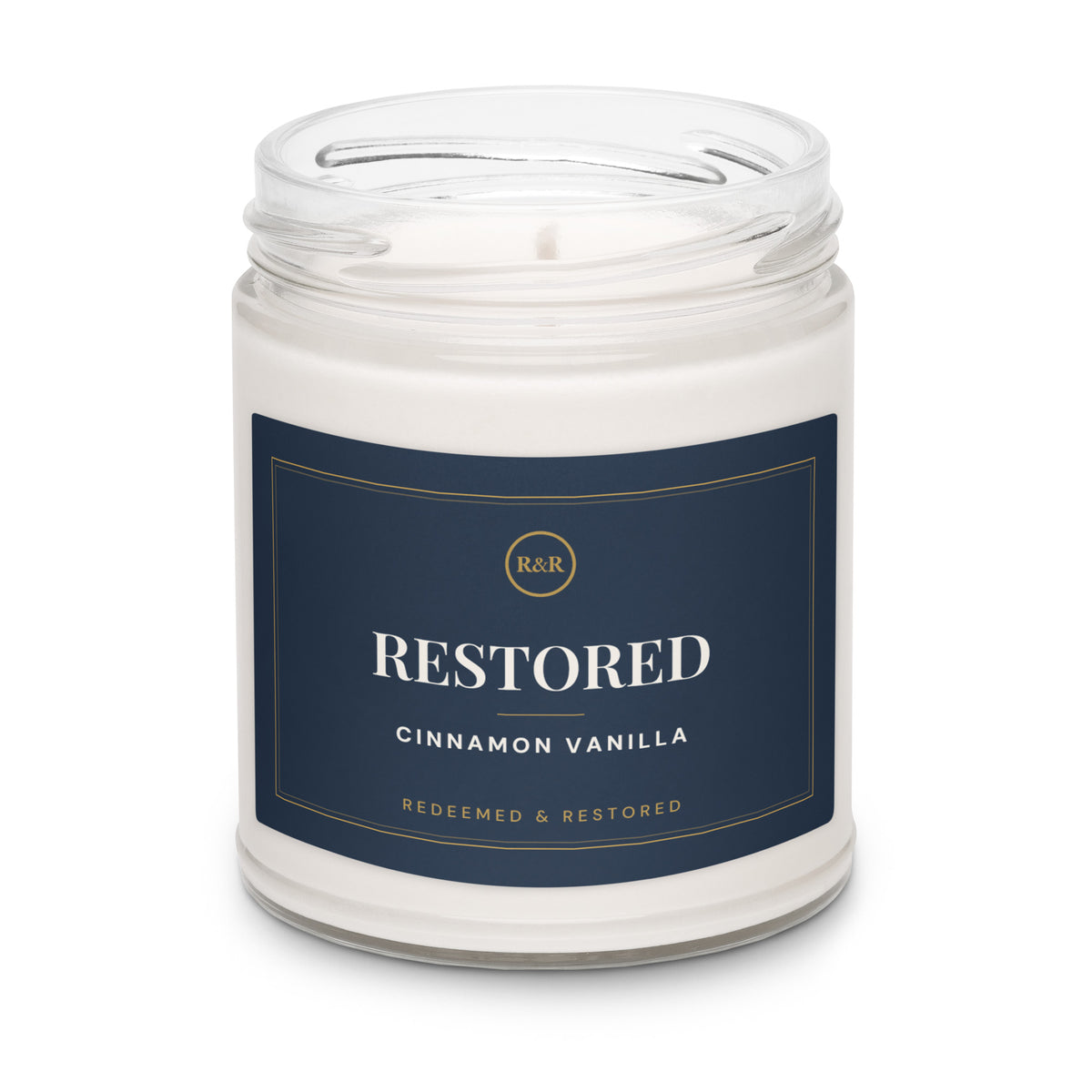 Restored Cinnamon Vanilla soy candle with the lid removed, showing white wax and wick in a clear glass jar