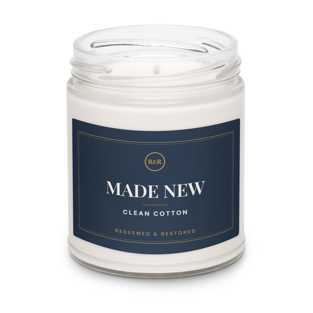 Made New Clean Cotton soy candle with the lid removed, showing white wax and wick in a clear glass jar