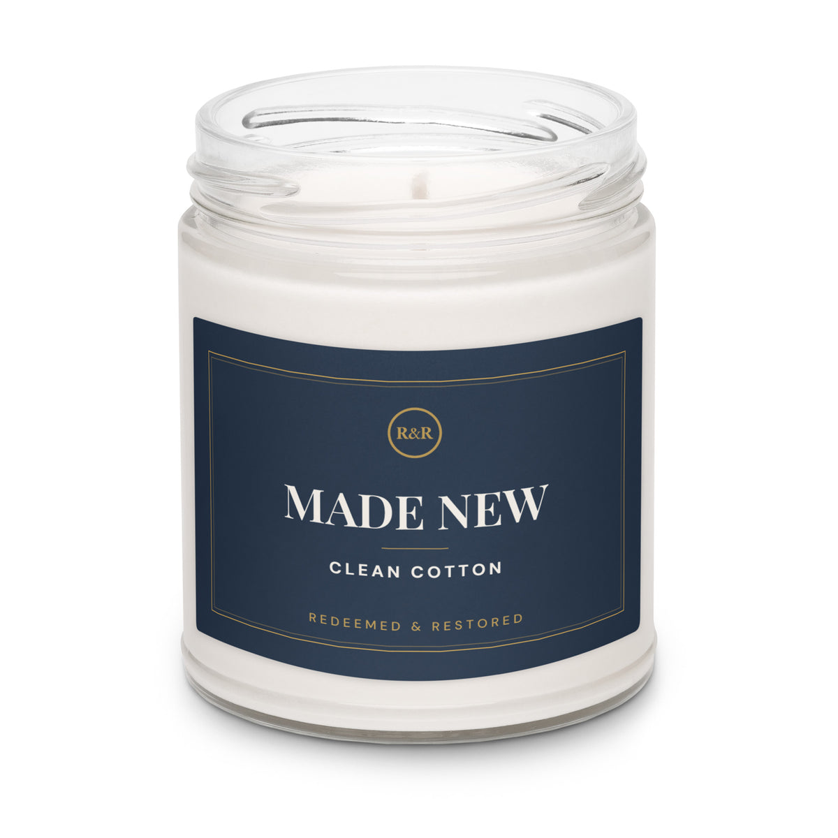Made New Clean Cotton soy candle with the lid removed, showing white wax and wick in a clear glass jar