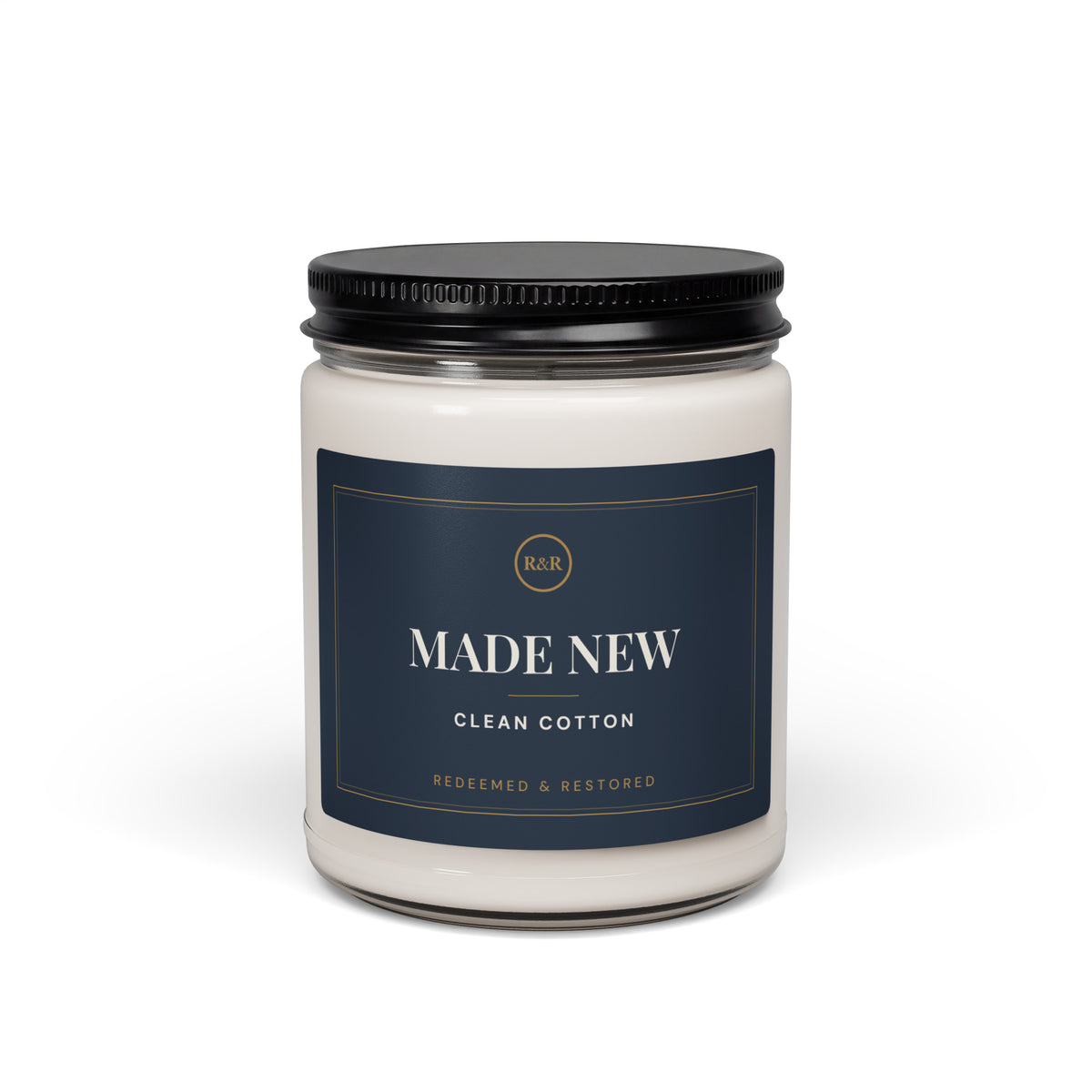Made New Clean Cotton candle in a glass jar with black lid and navy and gold label, front view